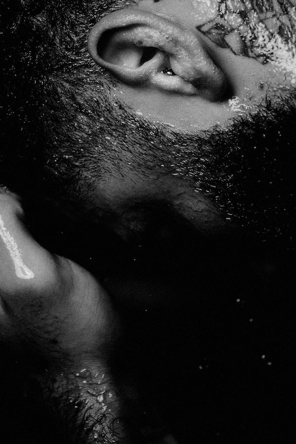 Reyal Performance skincare, hair & body care, a man washing his face using an athlete approved routine.