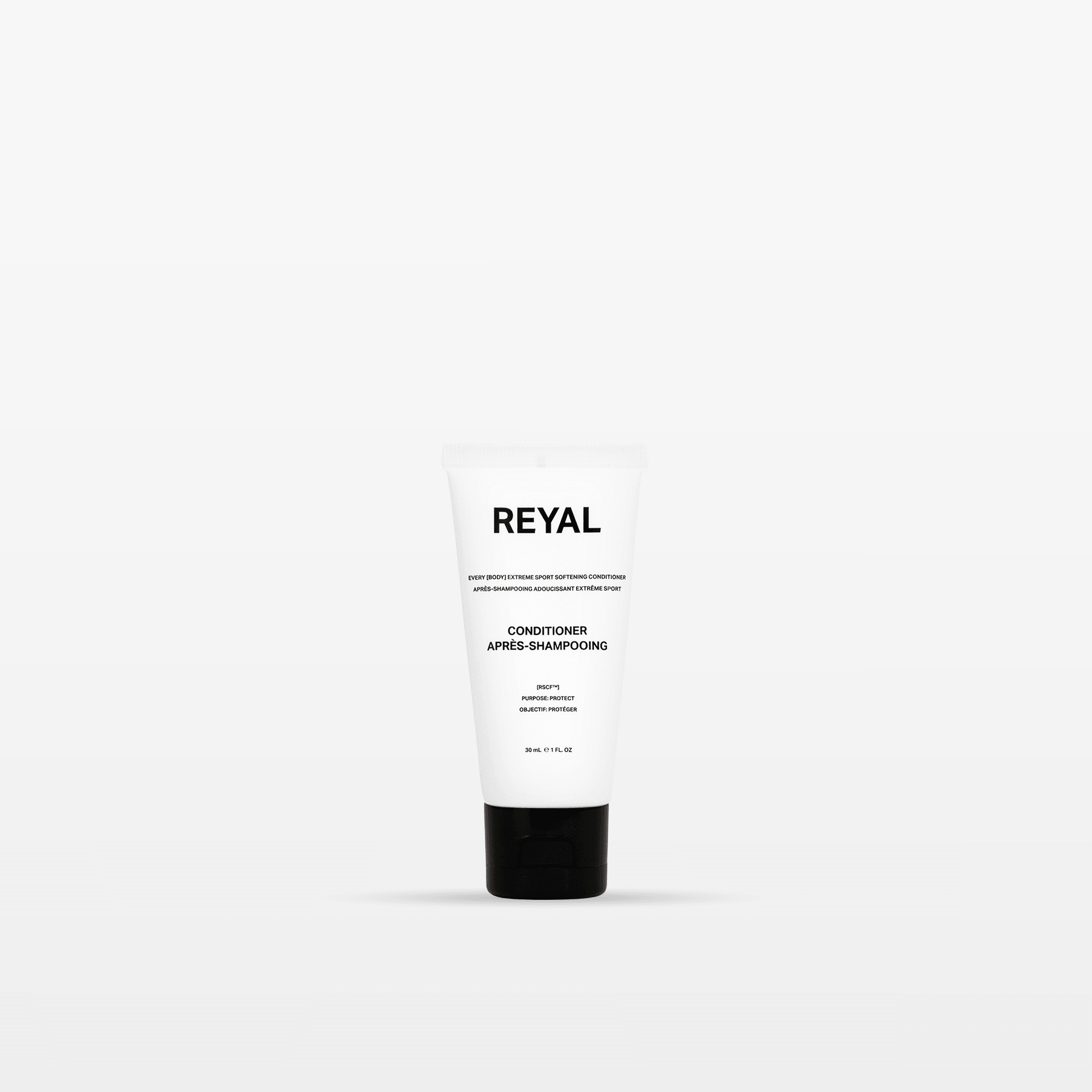 SOFTENING CONDITIONER [TRAVEL] in a sleek white tube from REYAL, perfect for restoring hair moisture.