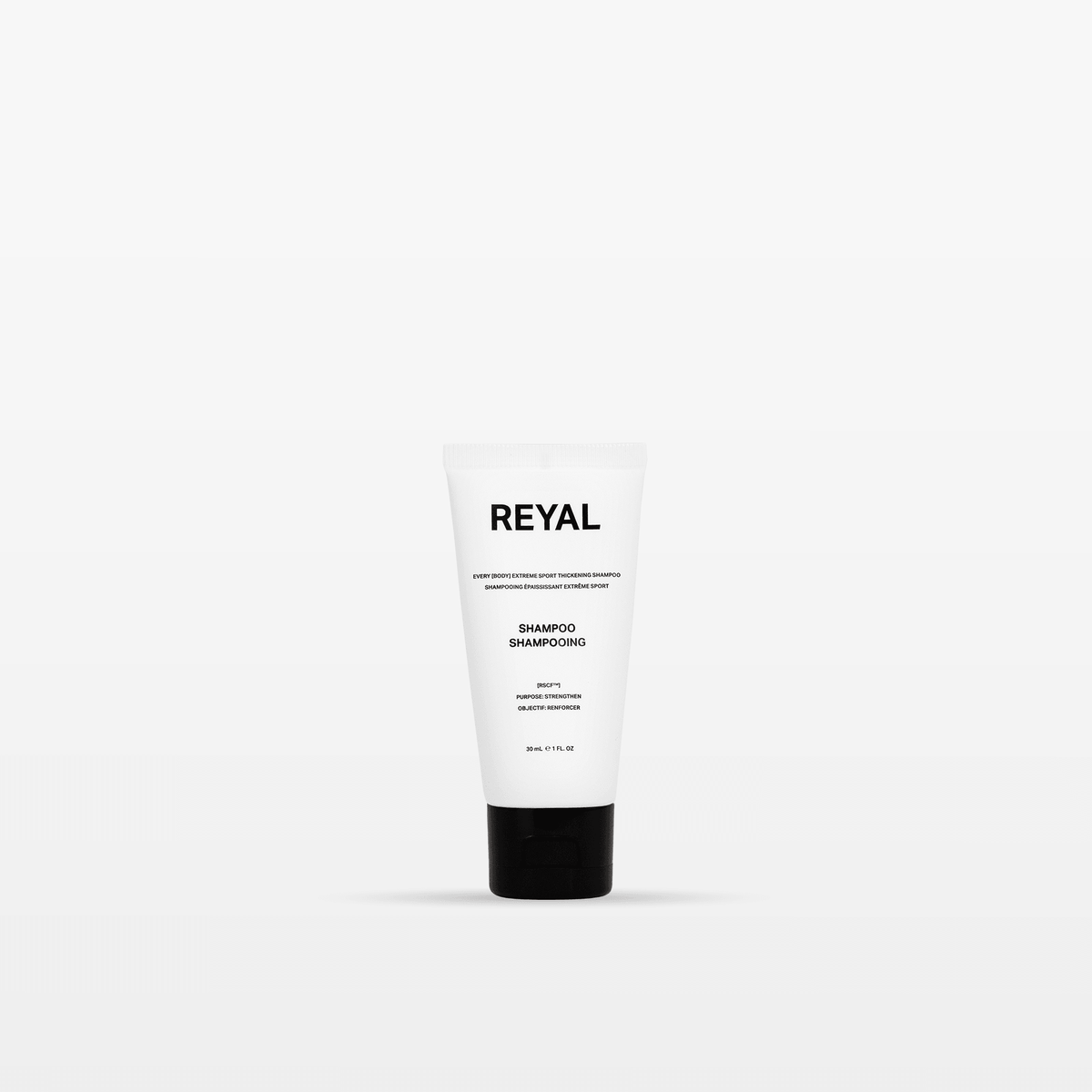 THICKENING SHAMPOO [TRAVEL] product image in a sleek white tube with black cap.
